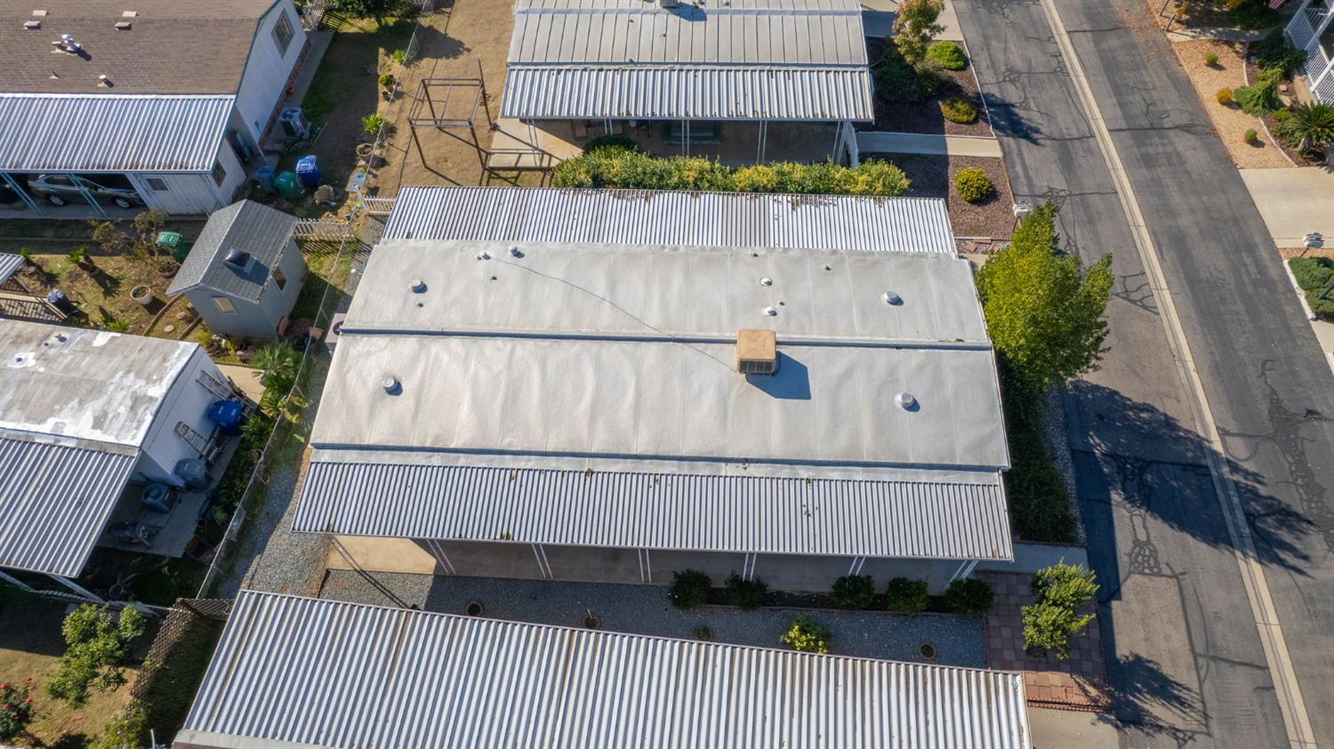 1300 West Olson Avenue, Unit 75 Reedley, CA 93654 - Photo 32 of 40 an aerial view of a house with a garden