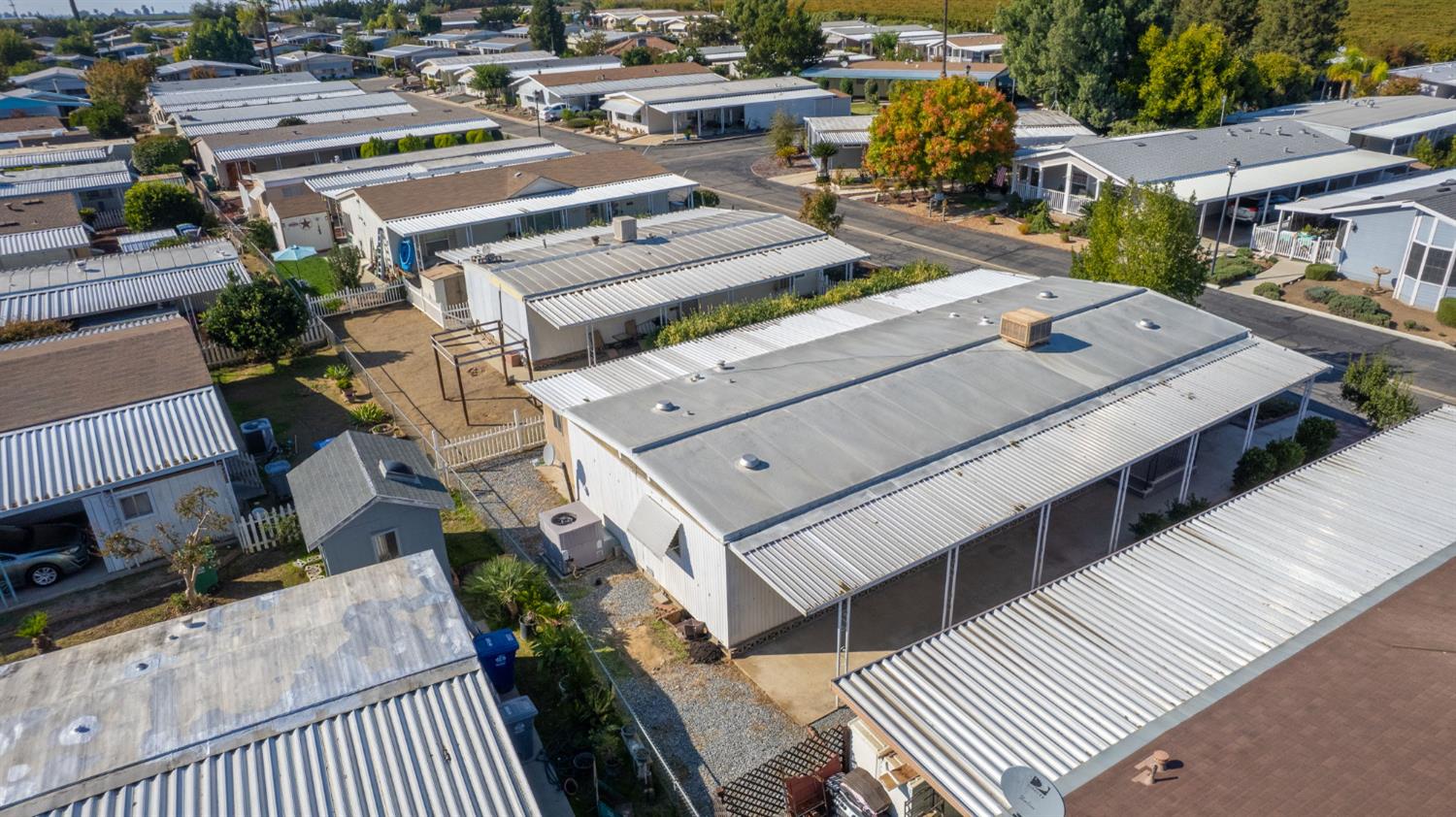 1300 West Olson Avenue, Unit 75 Reedley, CA 93654 - Photo 33 of 40 an aerial view of a house with a garden