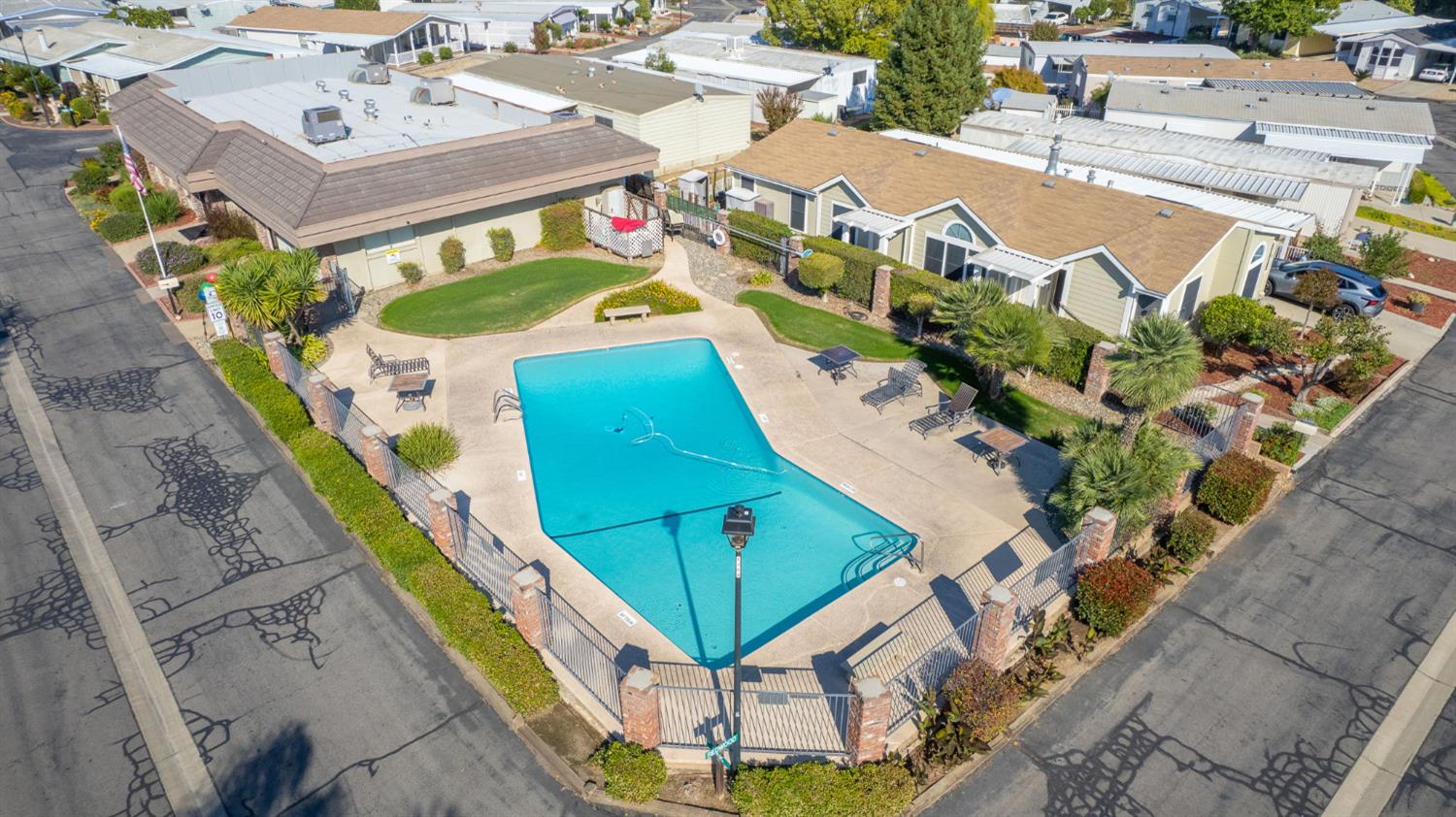 1300 West Olson Avenue, Unit 75 Reedley, CA 93654 - Photo 36 of 40 an aerial view of a house with a swimming pool