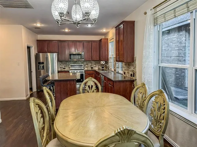 a view of a dining room with furniture