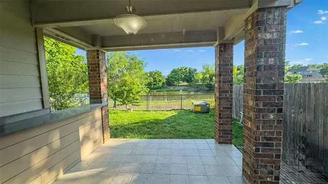 a view of a porch and garden