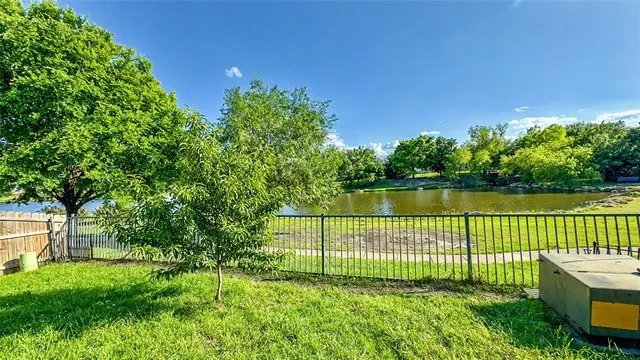 a view of a garden with a lake view