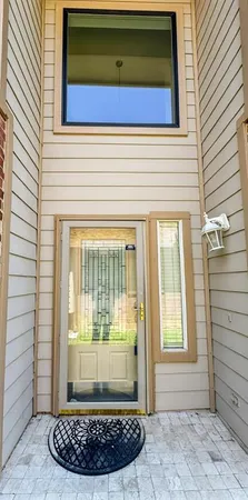 a view of wooden door of the house