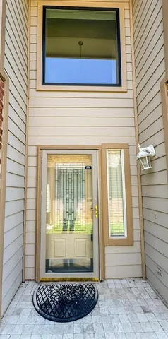 a view of wooden door of the house