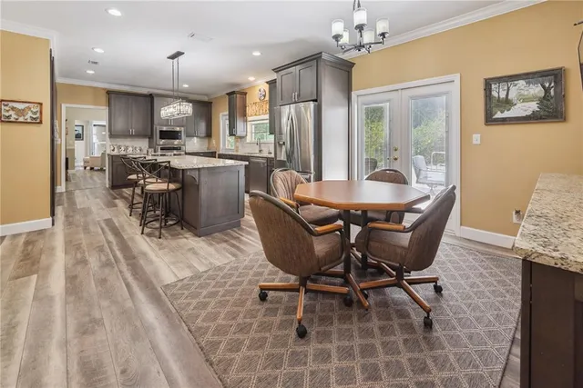 a bathroom with a toilet sink and shower curtain