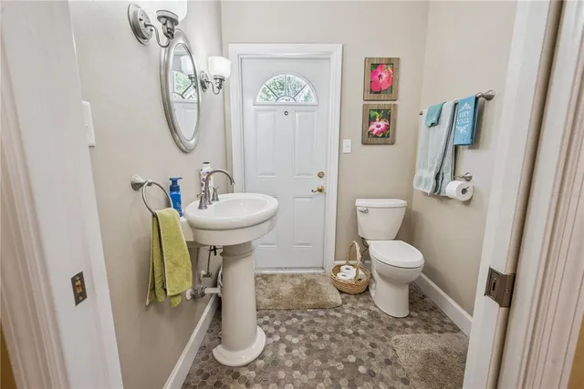 a view of a dining room with furniture wooden floor and chandelier