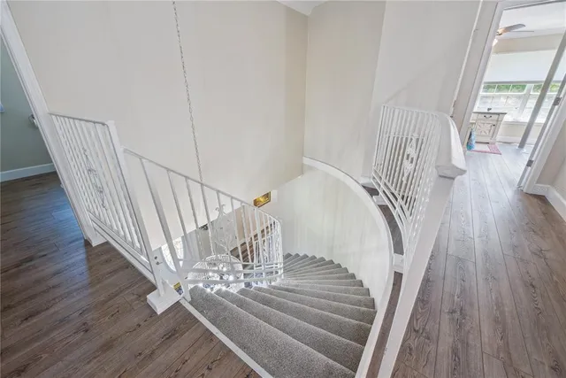 a spacious bedroom with a bed and a window