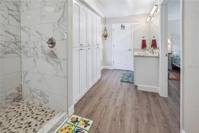 swimming pool view with a seating space and a garden view