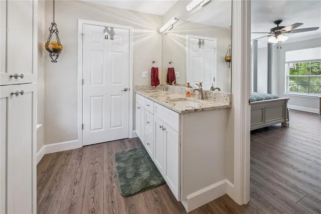 a view of backyard with seating space and trees