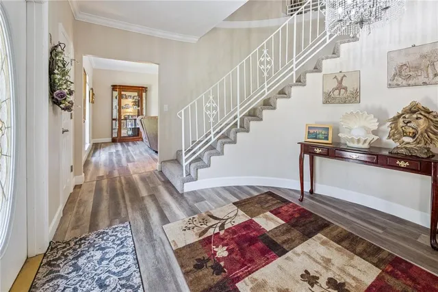 a view of entryway with wooden floor