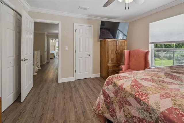 a view of a patio with a table and chairs under an umbrella