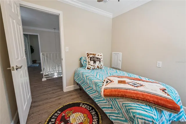 a view of a big house with a big yard and large trees