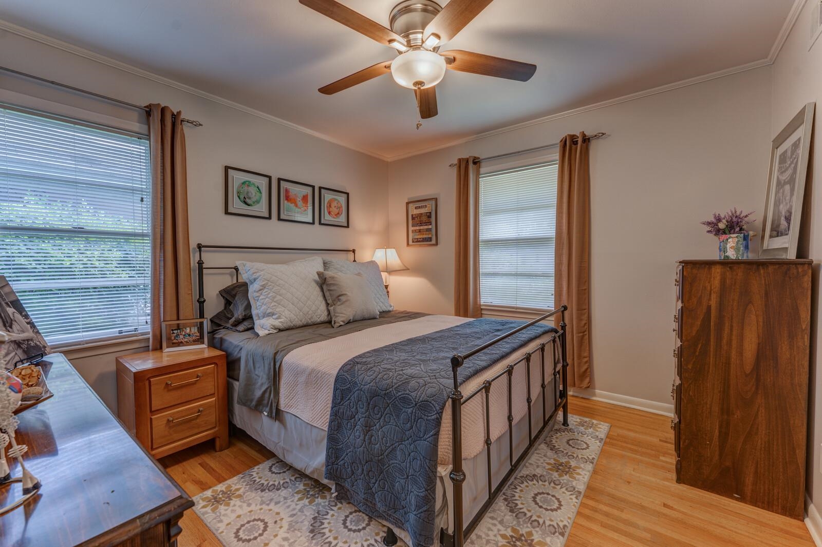 4783 Verne Road Memphis, TN 38117 - Photo 9 of 20 a bedroom with a bed and wooden floor