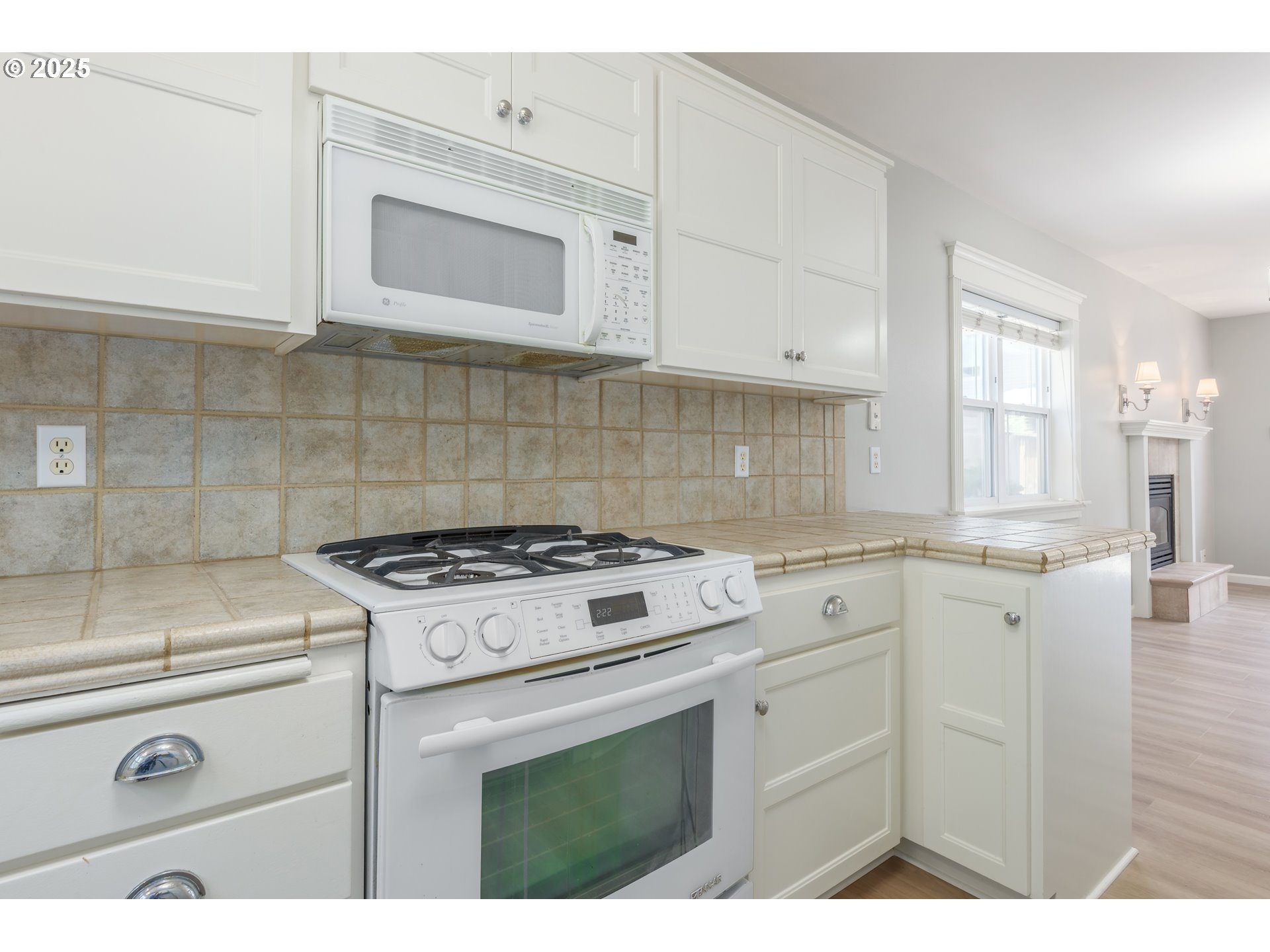 1507 Bogart Lane Eugene, OR 97401 - Photo 11 of 41 a kitchen with white cabinets and white appliances