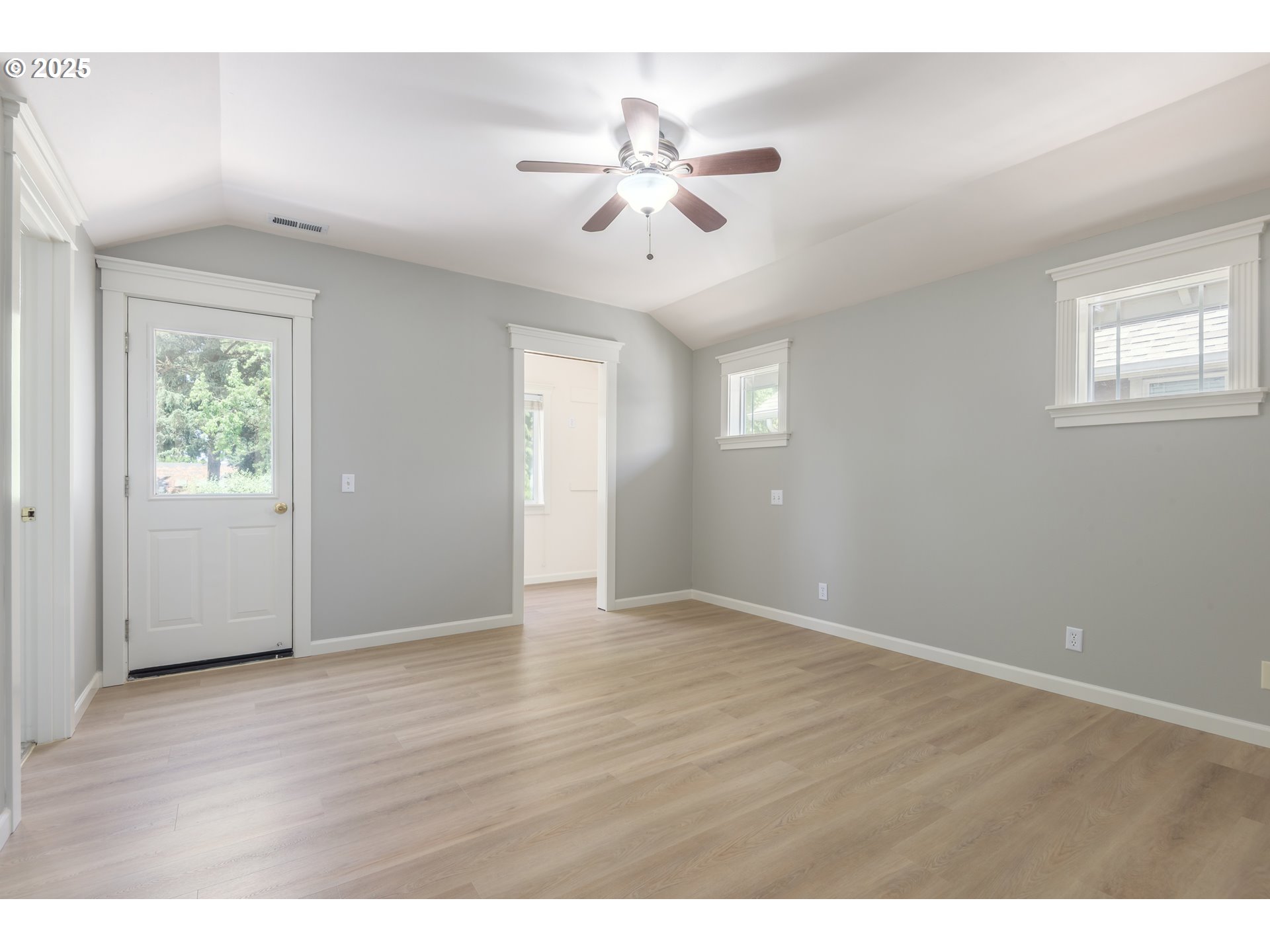 1507 Bogart Lane Eugene, OR 97401 - Photo 15 of 41 a view of an empty room with wooden floor and a window