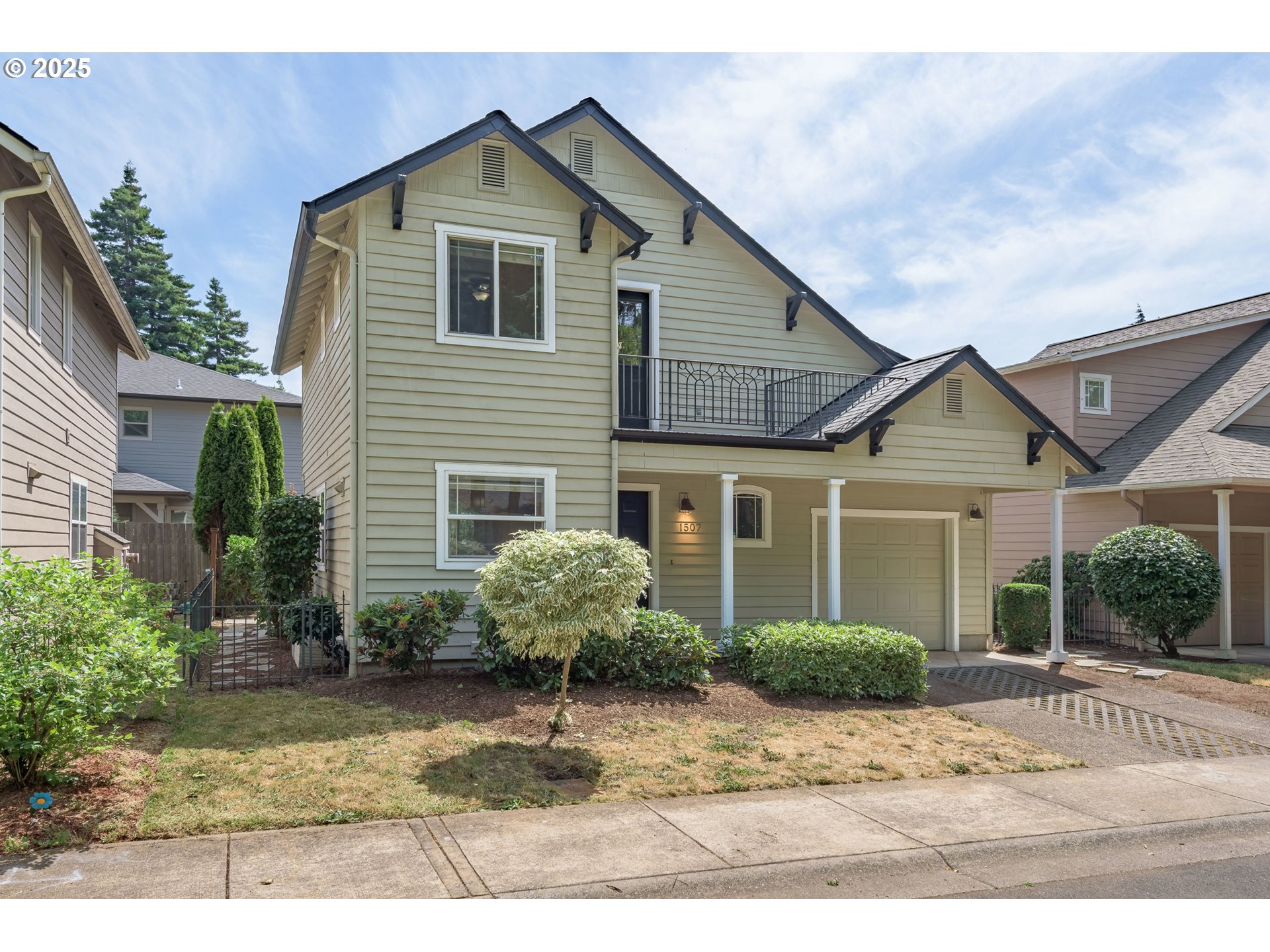 1507 Bogart Lane Eugene, OR 97401 - Photo 2 of 41 a front view of a house with a yard and potted plants