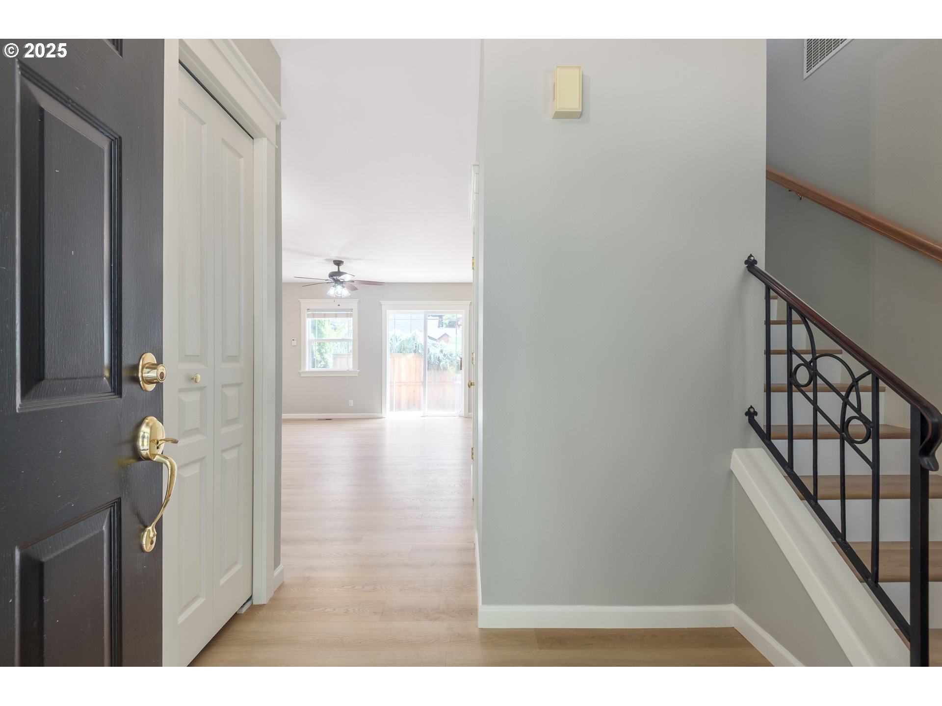 1507 Bogart Lane Eugene, OR 97401 - Photo 4 of 41 a view of a hallway with wooden floor and staircase