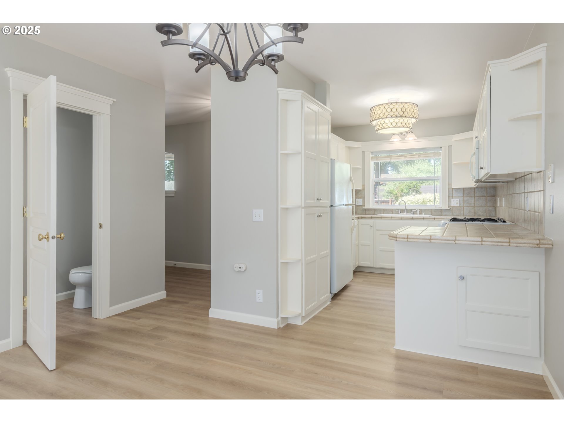 1507 Bogart Lane Eugene, OR 97401 - Photo 8 of 41 a kitchen with stainless steel appliances granite countertop a refrigerator and a sink