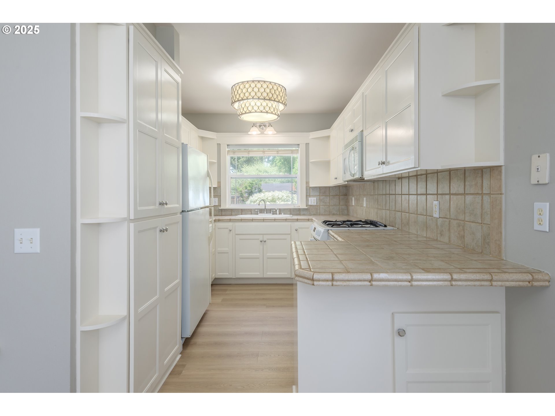 1507 Bogart Lane Eugene, OR 97401 - Photo 9 of 41 a kitchen with a sink cabinets and window
