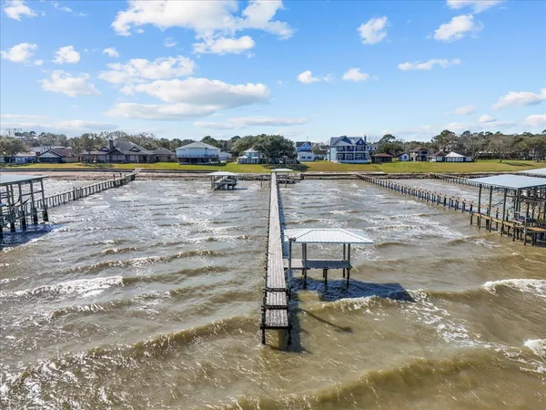 an aerial view of houses with outdoor space