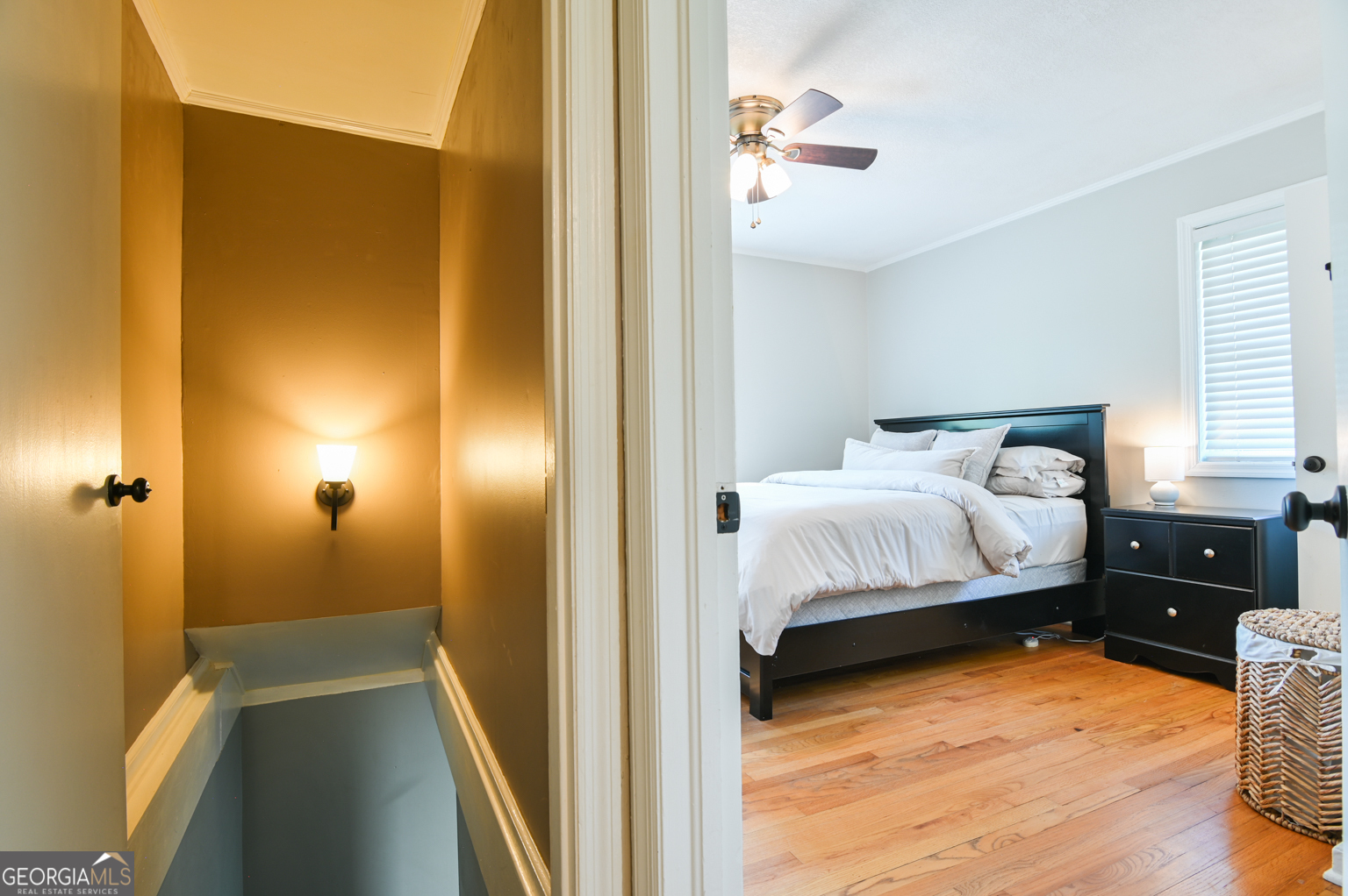 545 Forest Hill Road Macon, GA 31210 - Photo 55 of 63 a bedroom with a bed and wooden floor