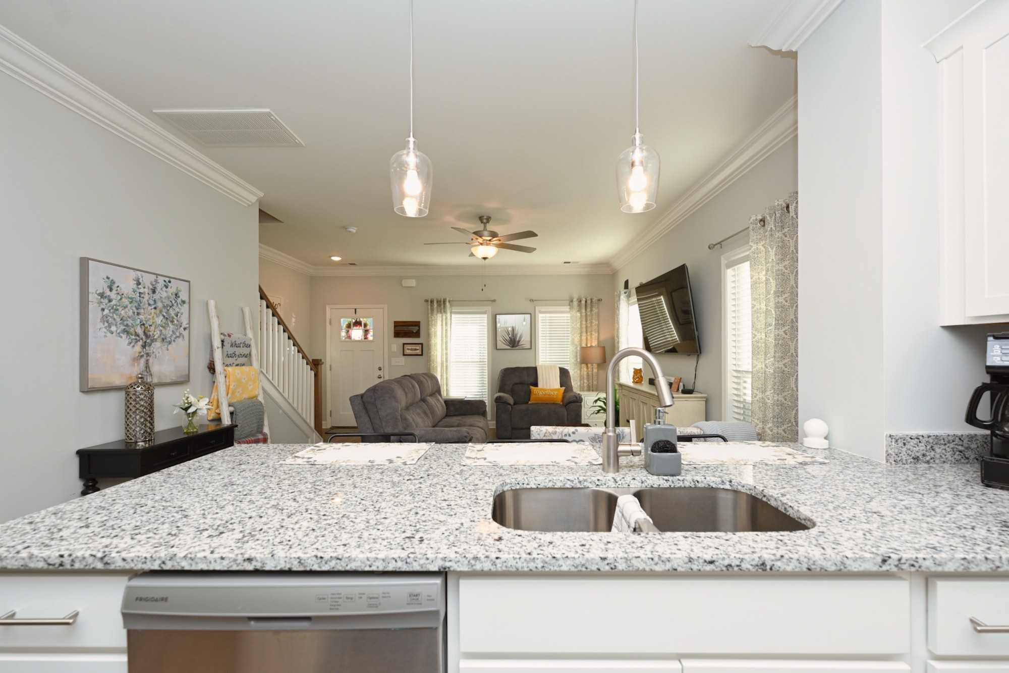 436 Withrow Way Gallatin, TN 37066 - Photo 11 of 41 a kitchen with a sink a counter top space and living room view