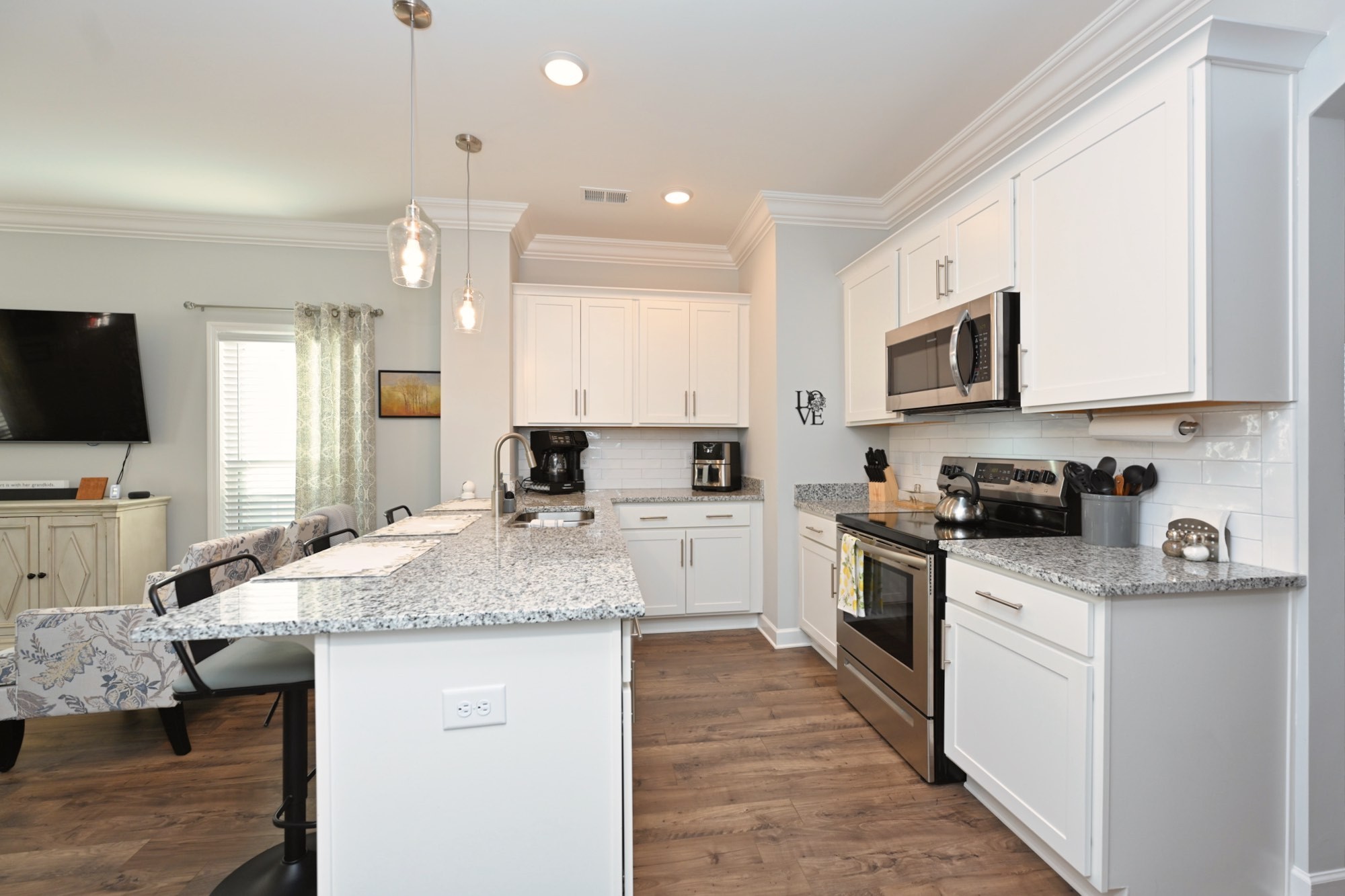 436 Withrow Way Gallatin, TN 37066 - Photo 16 of 41 a kitchen with granite countertop a sink stainless steel appliances and white cabinets
