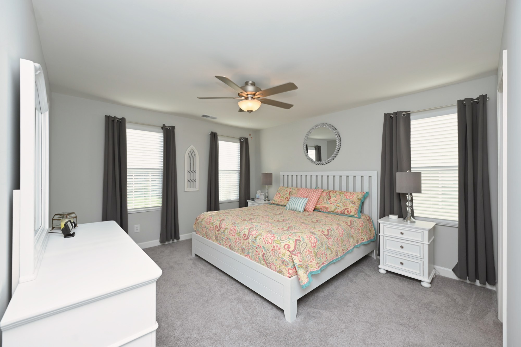 436 Withrow Way Gallatin, TN 37066 - Photo 25 of 41 a bedroom with a large bed and a chandelier