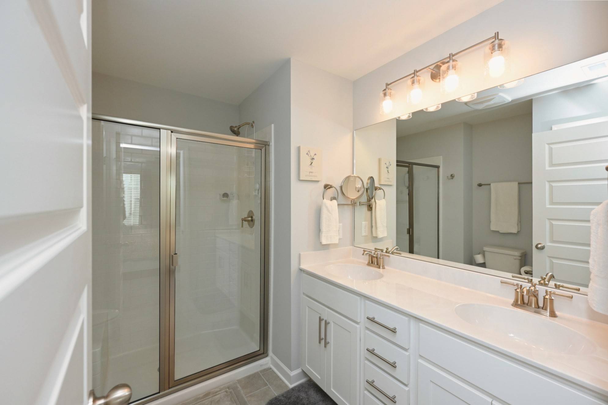 436 Withrow Way Gallatin, TN 37066 - Photo 27 of 41 a bathroom with a double vanity sink mirror and shower