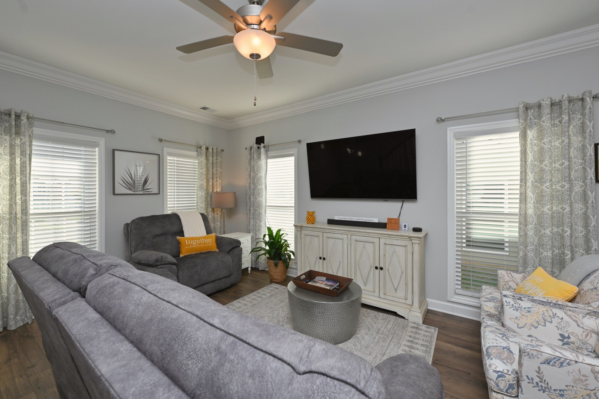 436 Withrow Way Gallatin, TN 37066 - Photo 5 of 41 a living room with furniture a flat screen tv and a window