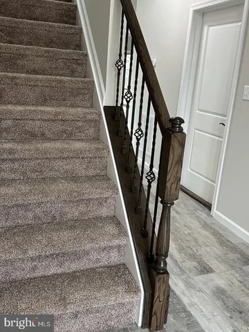 a view of stairs with wooden floor