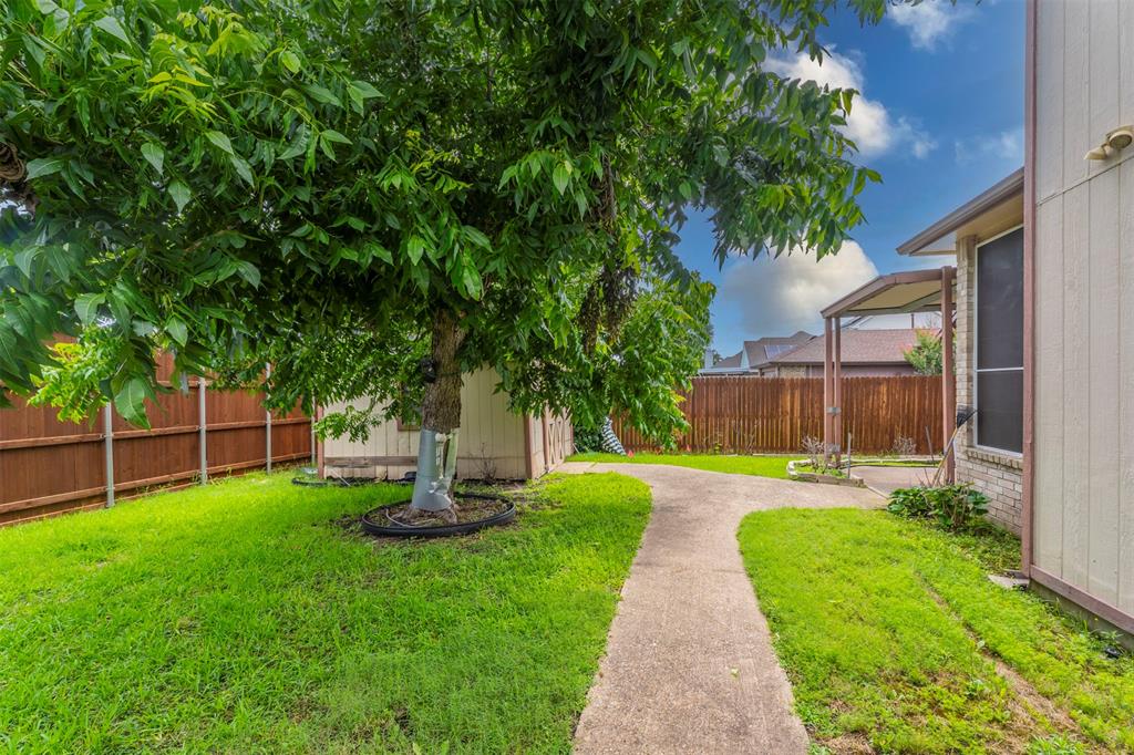 8317 Lake Bend Drive Rowlett, TX 75088 - Photo 33 of 35 Fenced backyard with a shed