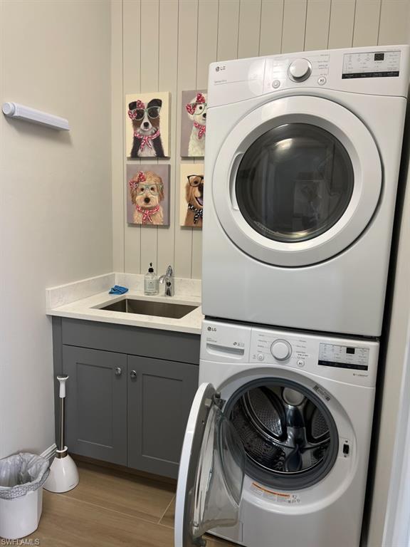 6605 Castlelawn Place, Unit 34 Naples, FL 34113 - Photo 11 of 21 a utility room with sink dryer and washer