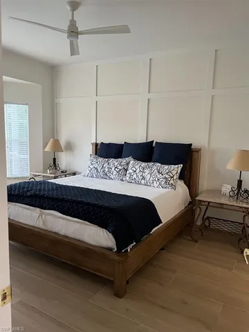 a bedroom with a bed and cabinet