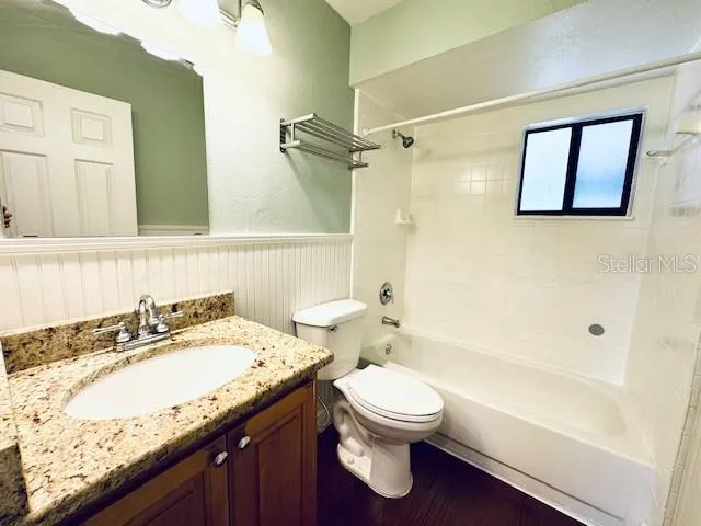 a view of a porch with a floor to ceiling window