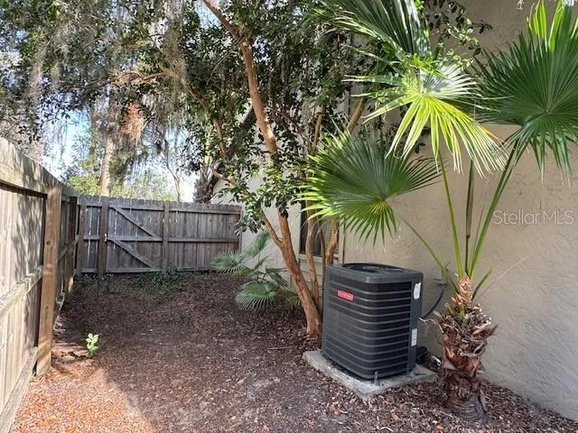 a view of garden with large trees
