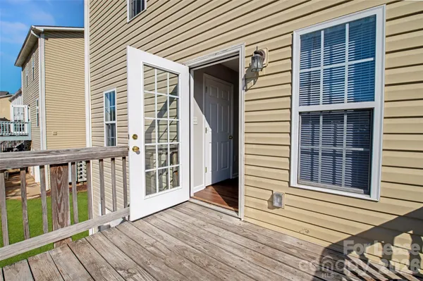 a view of a balcony with wooden floor