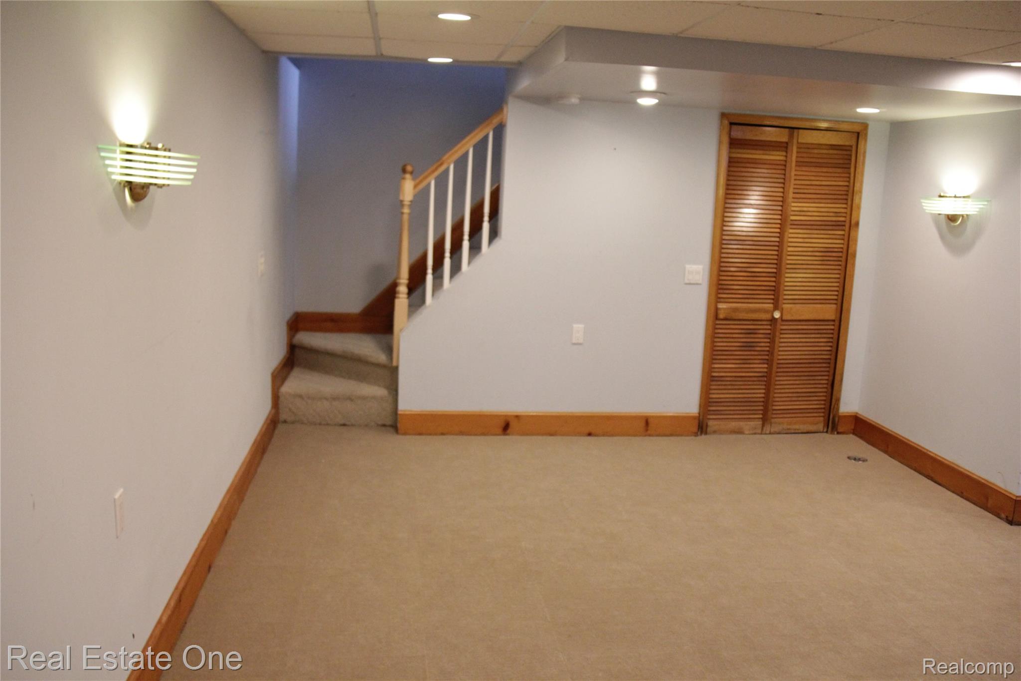 44777 Saltz Road Canton, MI 48187 - Photo 60 of 65 Spacious finished room with neutral carpeting and light blue walls