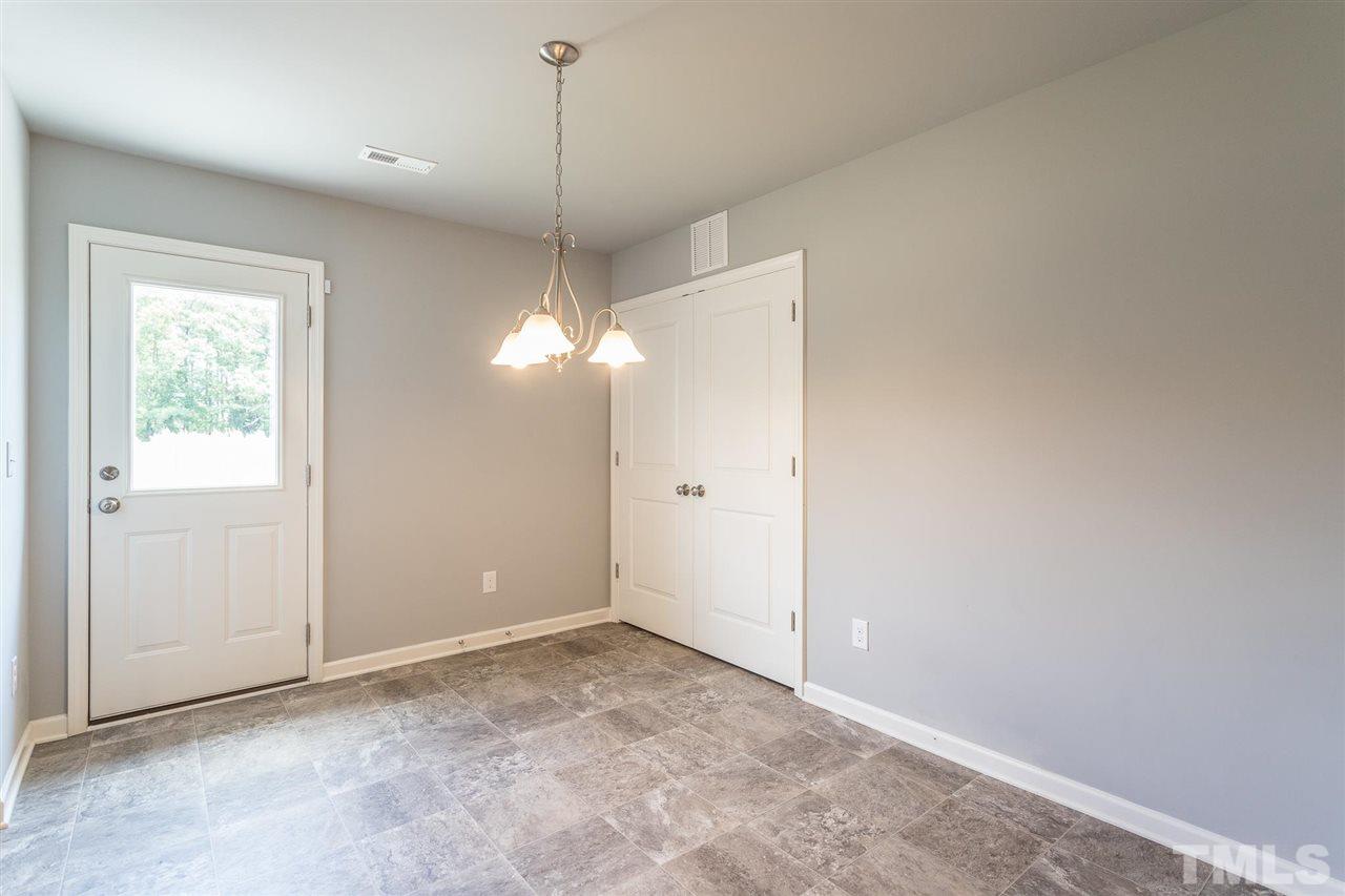 112 Willow Ridge Circle Willow Spring, NC 27592 - Photo 12 of 30 a view of an empty room with a window