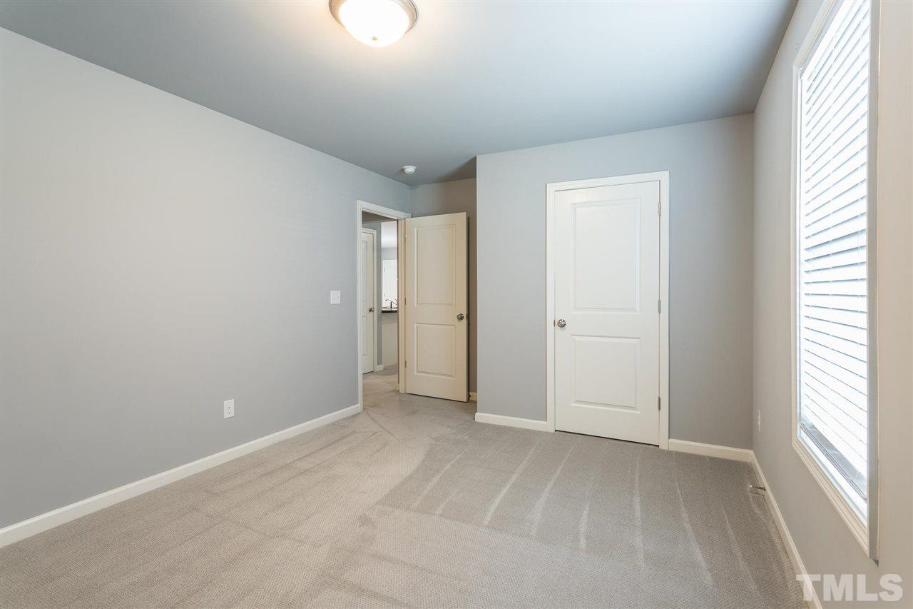 112 Willow Ridge Circle Willow Spring, NC 27592 - Photo 27 of 30 a view of an empty room with a window