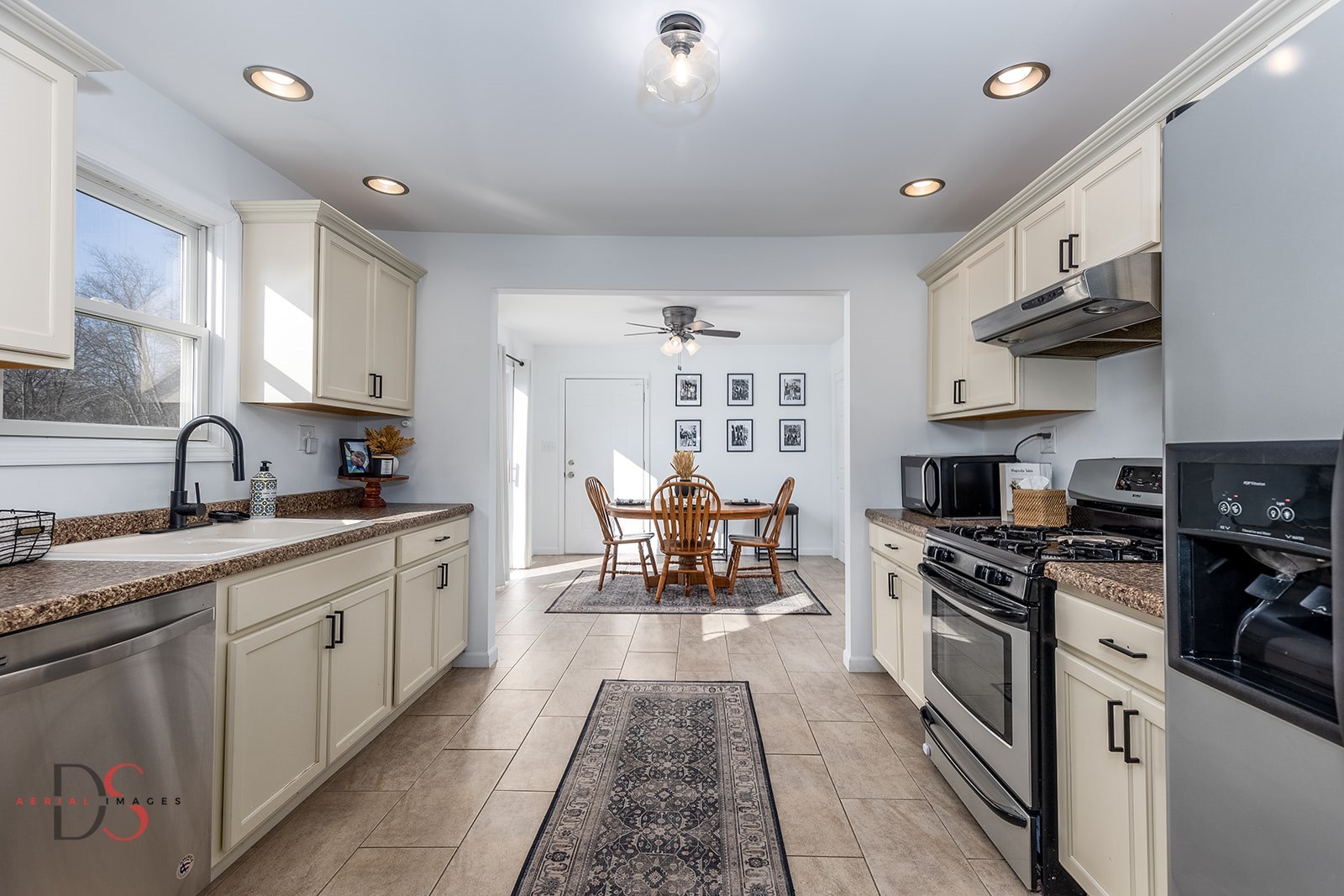 710 Daisy Court Seneca, IL 61360 - Photo 12 of 38 a large kitchen with stainless steel appliances granite countertop a sink and cabinets