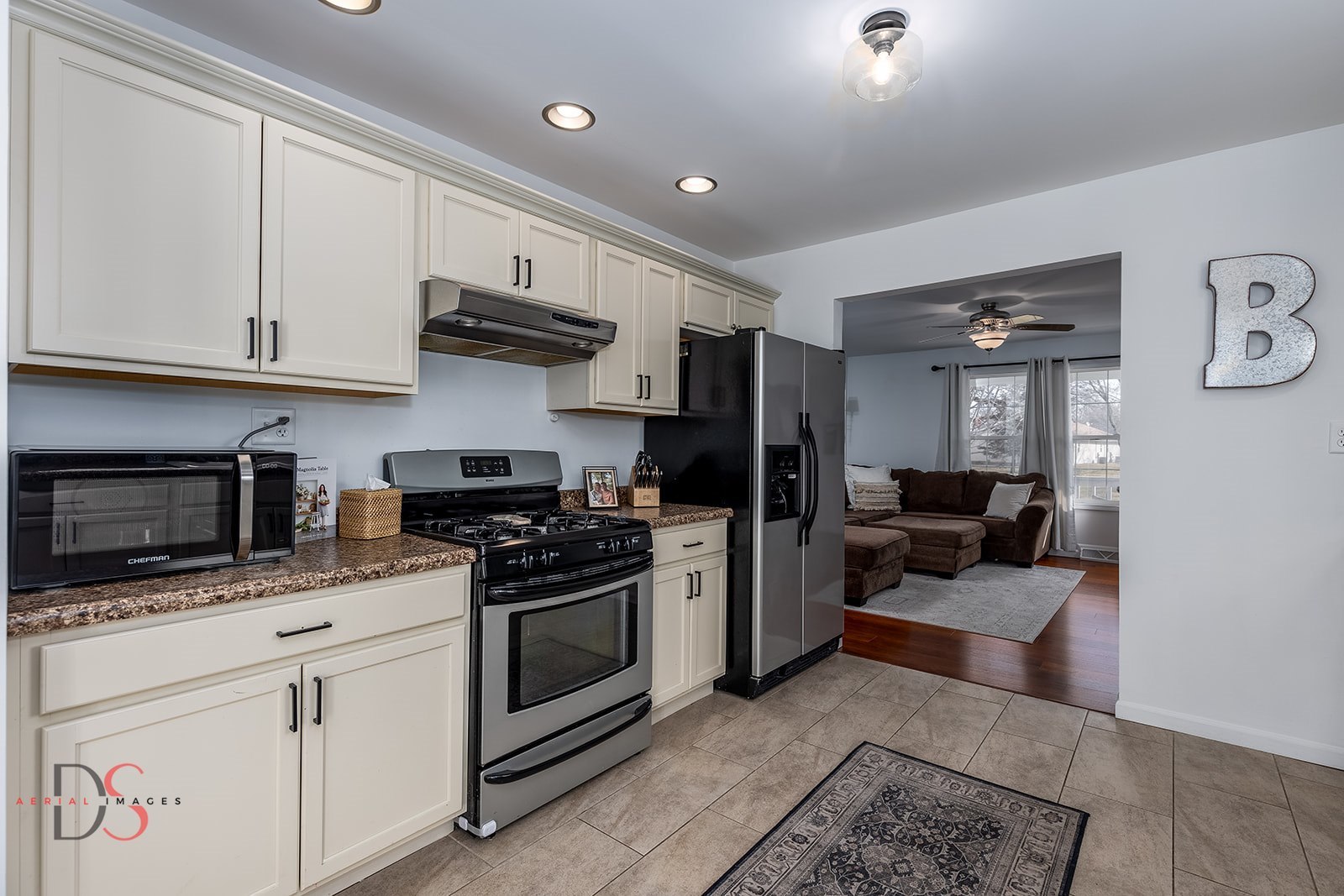 710 Daisy Court Seneca, IL 61360 - Photo 14 of 38 a kitchen with stainless steel appliances granite countertop a stove a sink and a microwave