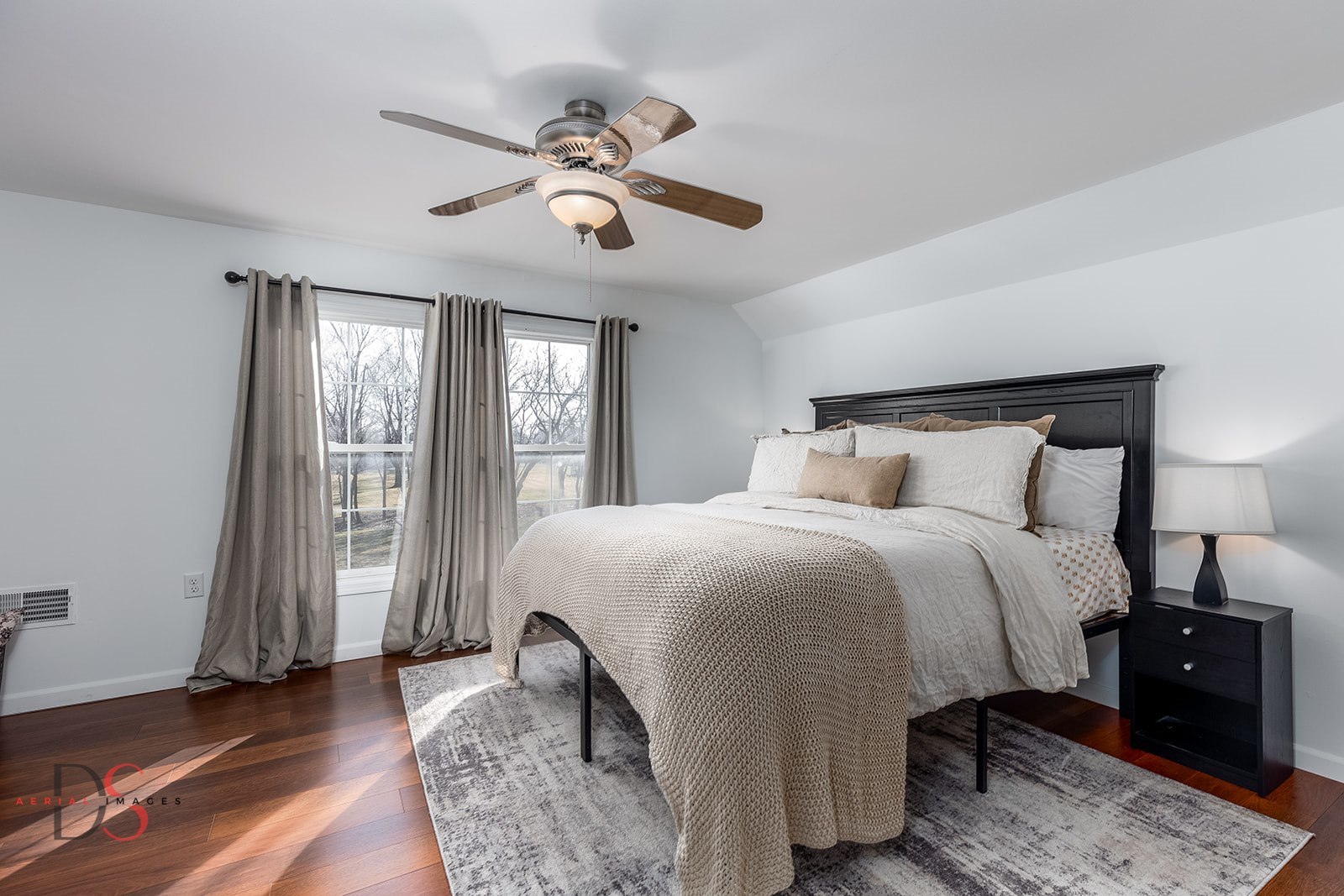 710 Daisy Court Seneca, IL 61360 - Photo 19 of 38 a bedroom with a large bed and a chandelier