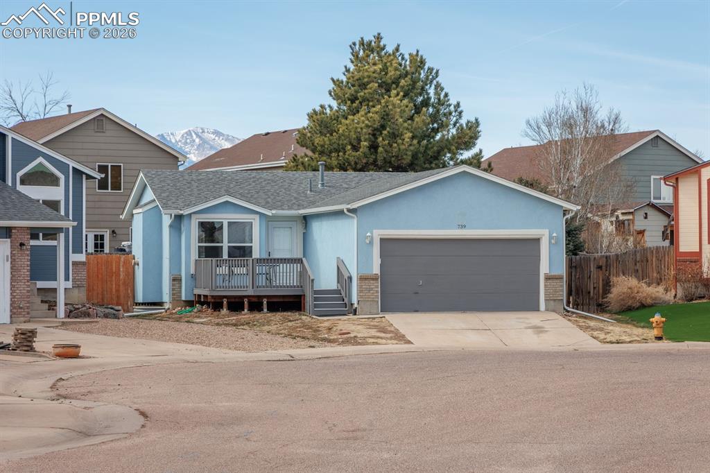 739 Memory Lane Fountain, CO 80817 - Photo 1 of 37 a front view of a house with a yard and garage