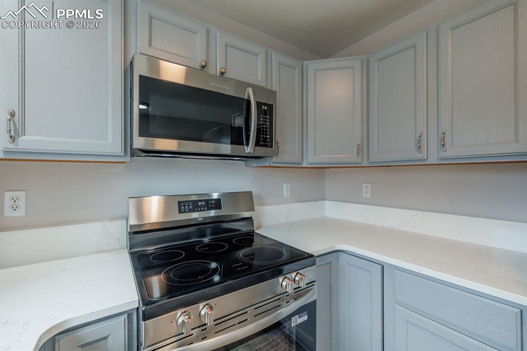739 Memory Lane Fountain, CO 80817 - Photo 11 of 37 a kitchen with microwave cabinets and stove top oven