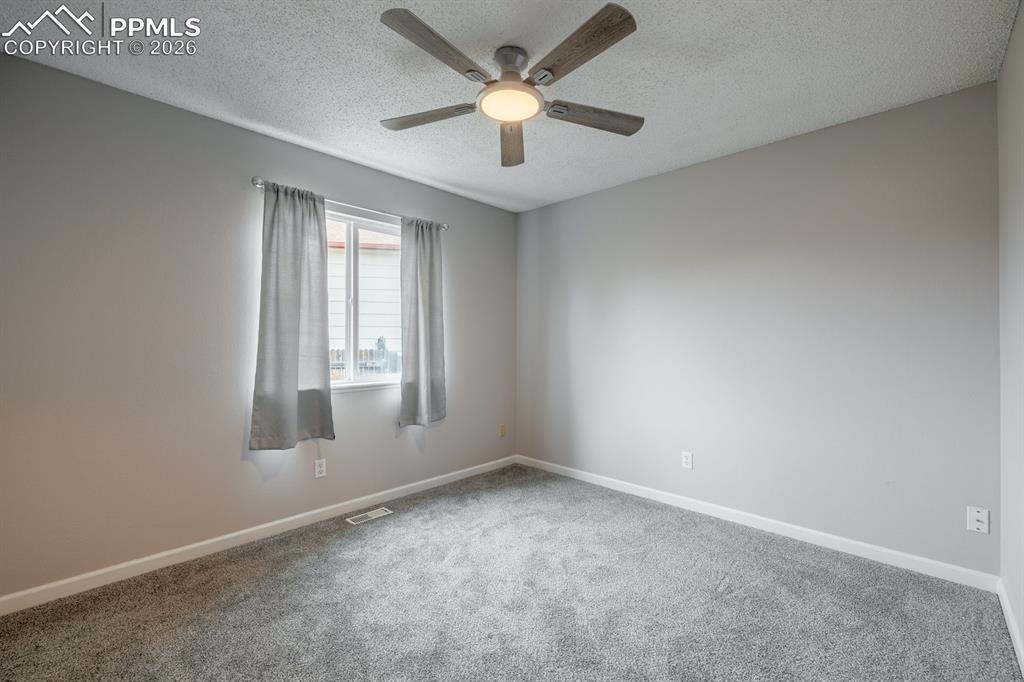 739 Memory Lane Fountain, CO 80817 - Photo 17 of 37 an empty room with a window and a fan