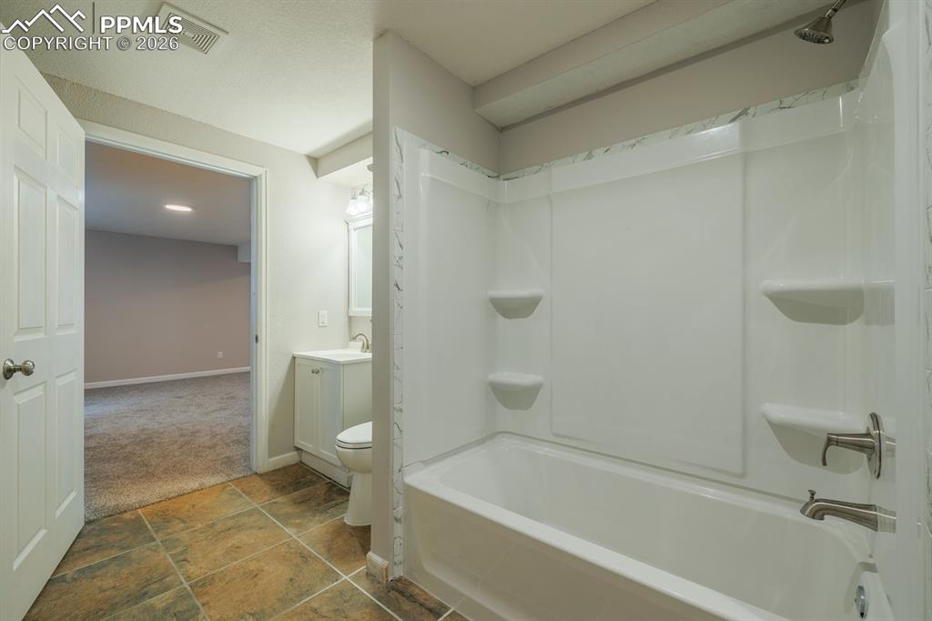 739 Memory Lane Fountain, CO 80817 - Photo 23 of 37 a bathroom with a bathtub and a toilet