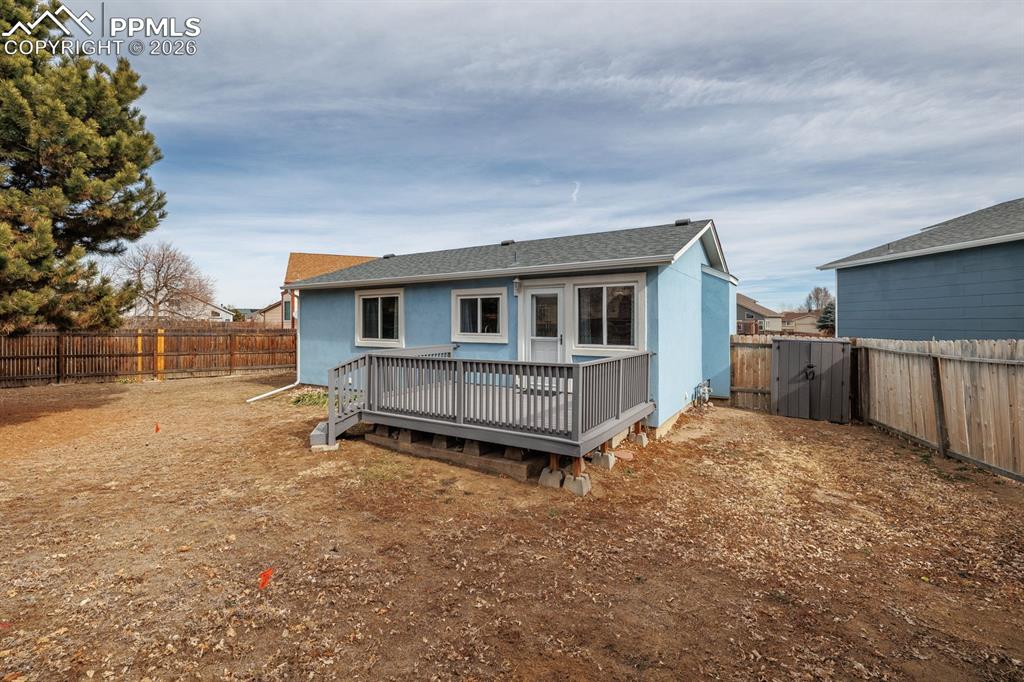 739 Memory Lane Fountain, CO 80817 - Photo 29 of 37 a view of backyard of house with wooden deck and seating space