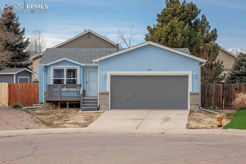 739 Memory Lane Fountain, CO 80817 - Photo 3 of 37 a front view of a house with a garage