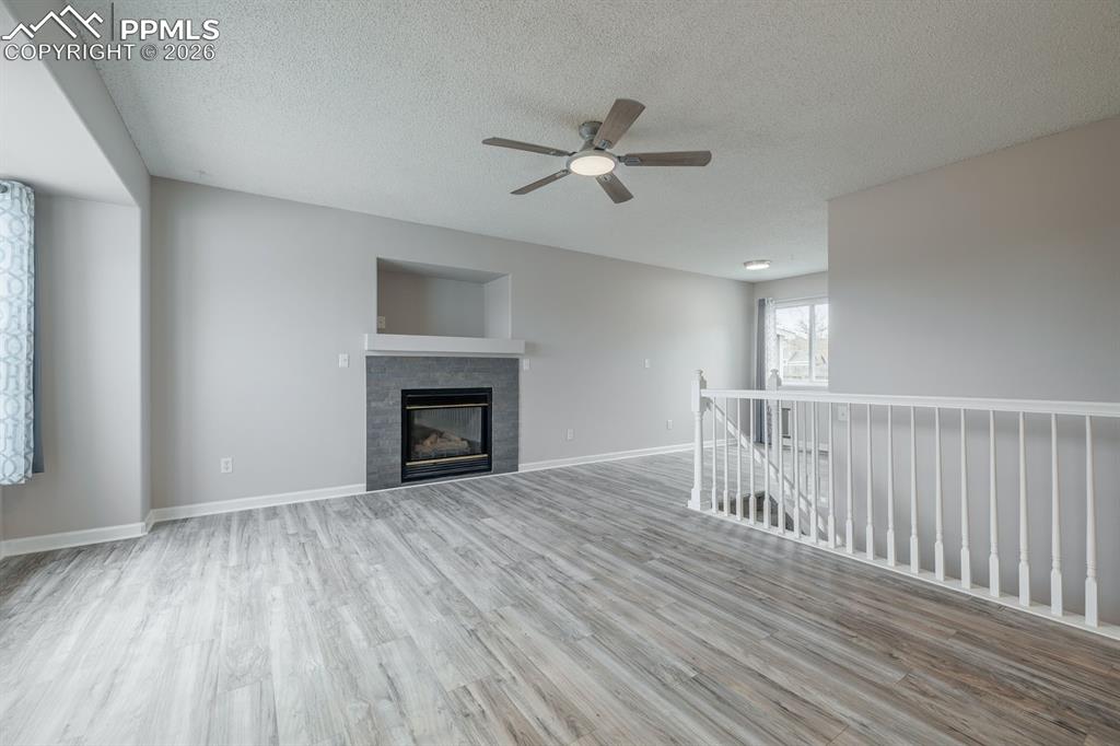 739 Memory Lane Fountain, CO 80817 - Photo 5 of 37 a view of empty room with wooden floor and fan